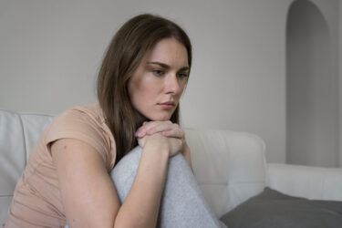 side-view-anxious-woman-home-1